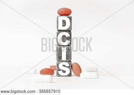 A Group Of White And Red Pills And Cubes With The Word Dcis Ductal Carcinoma In Situ On Them, White 
