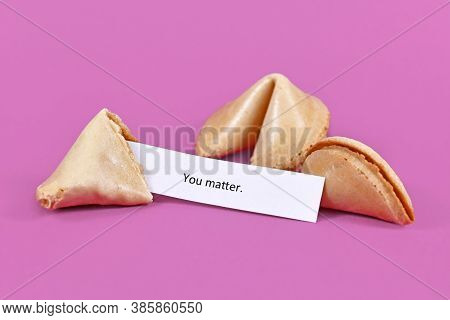 Open Fortune Cookie With Motivational Text On Paper Saying 'you Matter' On Violet Background