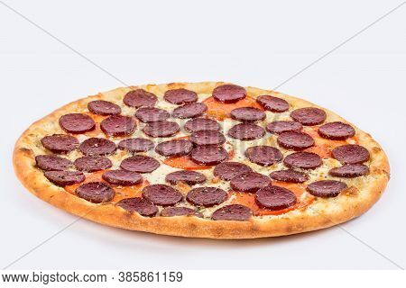 Pepperoni Pizza Shot On A White Plate Under The Tenderloin