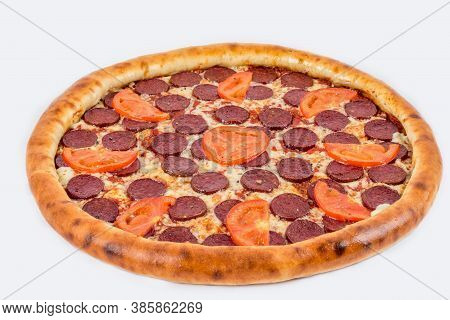 Pepperoni Pizza Shot On A White Plate Under The Tenderloin