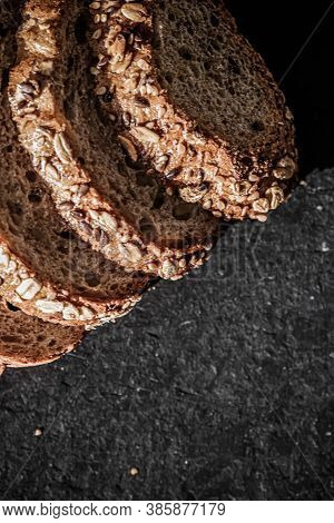 Fresh Whole Grain Seeded Bread, Organic Wheat Flour, Closeup Slice Texture As Background For Food Bl