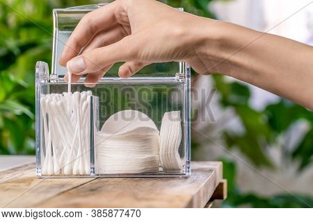 Woman's Hand Takes Out White Cotton Swabs From The Organizer Close Up