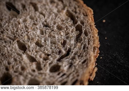 Fresh Whole Grain Seeded Bread, Organic Wheat Flour, Closeup Slice Texture As Background For Food Bl