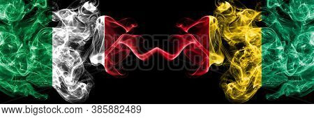 Italy Vs Guinea, Guinean Smoky Mystic Flags Placed Side By Side. Thick Colored Silky Abstract Smoke 