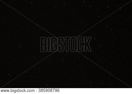 Black Texture With Micro-relief And Glitter Similar To The Night Sky With Stars