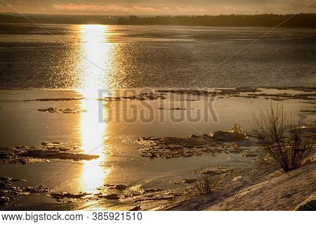 Gold Sunset Over A Wide River With Birds. Winter Nature Water Landscape With Pigeons. Kama, Perm, Ru