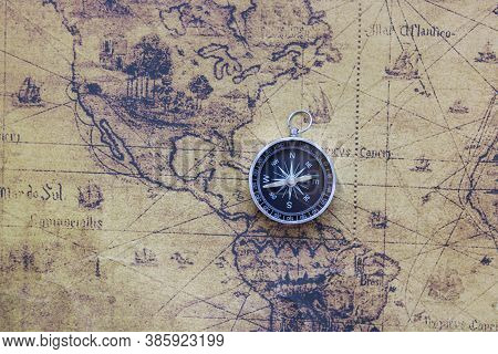 Classic Round Compass On Background Of Old Vintage Map Of World As Symbol Of Tourism With Map, Trave
