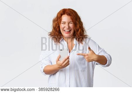 Technology And Communcation Concept. Carefree Happy Laughing Middle-aged Woman Looking Pleased, Smil