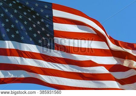Close Up: American Flag Waving In Wind. Realistic Usa Flag Background. American Flag. Waved Highly D
