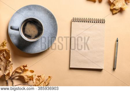 Empty Blank Scetchbook With Space And Autumn Cozy Coffee In Grey Cup On Beige Background. Copy Space
