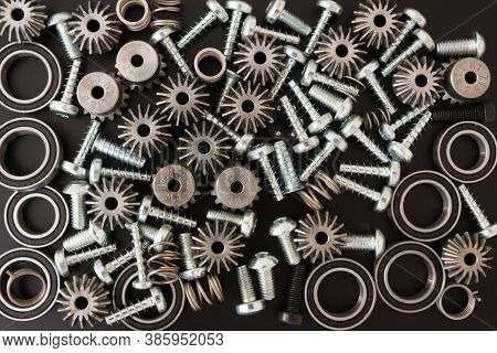 Mechanical Components On Black Background. Industrial Objects