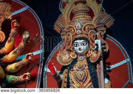 Idol Of Goddess Saraswati, Decorated Durga Puja Pandal, Durga Puja Festival At Night. Shot Under Col