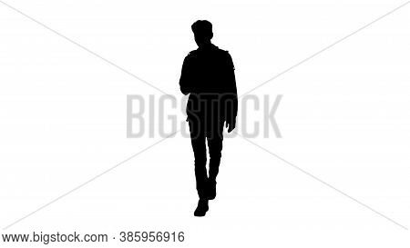 Silhouette Young Man In Casual Clothes Text Messaging On Cell Ph