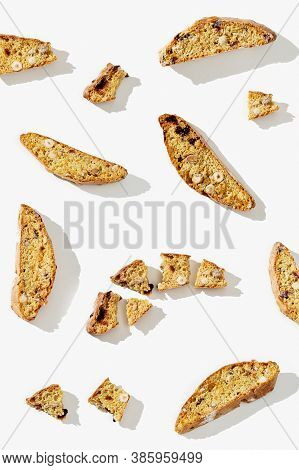 Several Pieces Italian Biscotti Cookies On White Background. Fresh Broken Cookies With Nuts And Drie