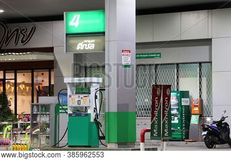 Muang, Pathumthani,thailand Apr 24, 2018: Gas Dispenser Of Pt Gas Station On The Night. Pt Is A Trad