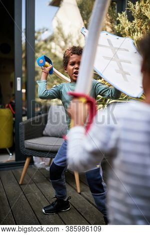 Children playing with swordplay outdoor