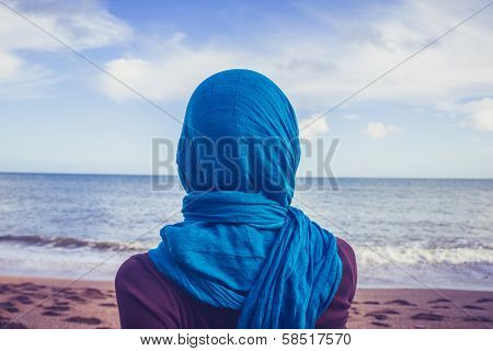Rear View Of Woman With Headscarf Looking At The Sea