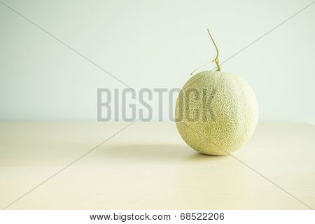 Cantaloupe melon over wooden
