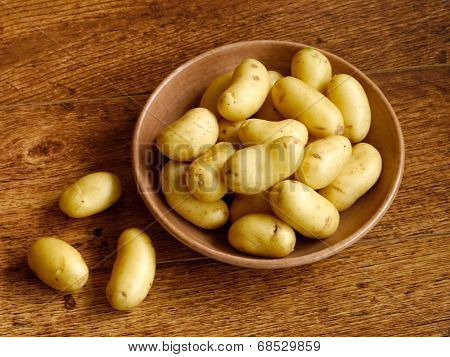 Young Potatoes In Bowl On Wooden Table