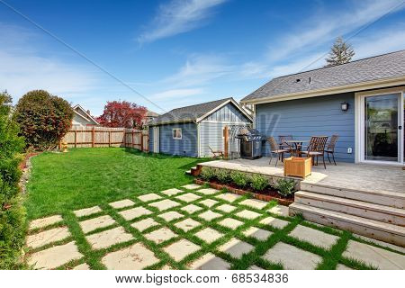 House Backyard With Patio Area On Walkout Deck