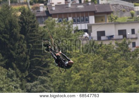 Professional  Kitesurfer Jumps Over The Water During Training On Lake Of Santa Croce