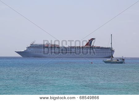 Carnival Paradise Cruise Ship anchors at the Port of George Town, Grand Cayman