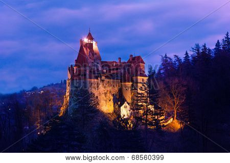 Dracula Castle with lights at night in Romania