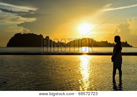 Girls On The Beach During Sunrise.