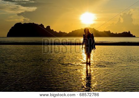 Girls On The Beach During Sunrise.