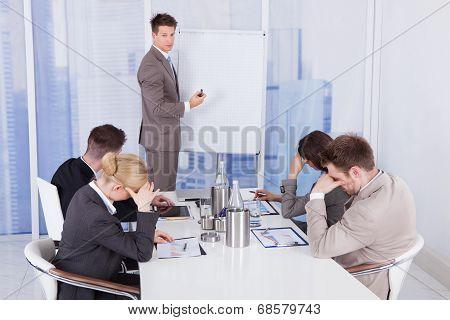 Colleagues Getting Bored During Business Presentation