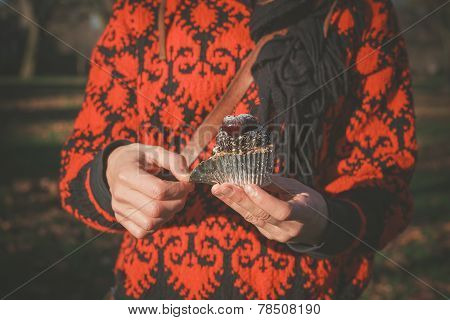 Woman In Park With Cupcake