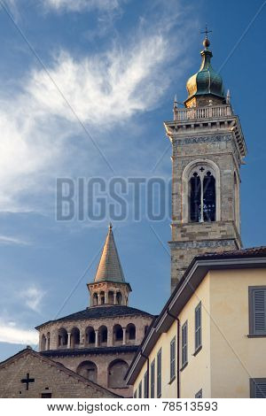 Church steeple against a background of clouds in Bergamo.