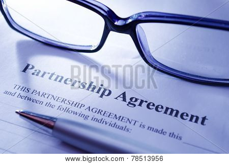 Close Up Glasses And Pen On Top Of Agreement Paper