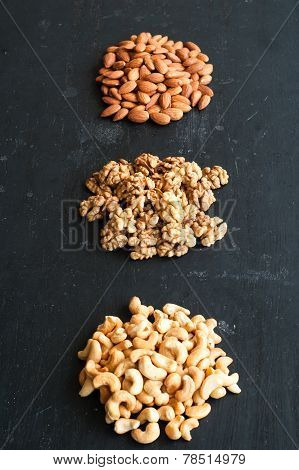 Different Types Of Nuts On Black Background