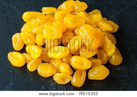 Dry Yellow Cumquat On Black Background