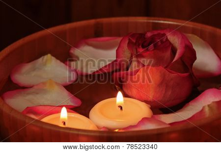Rose Petals, Candles  And Rose In Bowl With Water. Selective Focus On The Candle