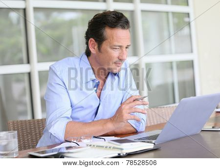 Man working from home on laptop computer
