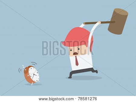 Businessman Is Trying To Smash Alarm Clock By Using Big Hammer