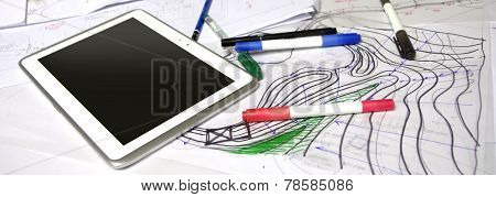 Architect Sketches With Papers, Markers, Pens And Tablet