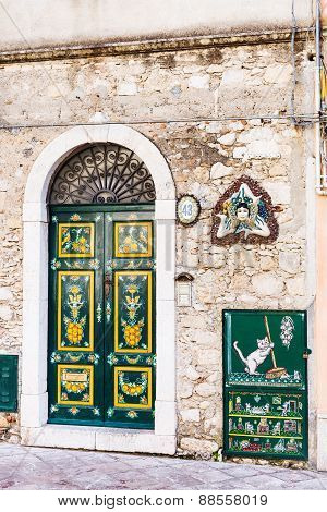 Decoration Of Urban House Door And Trinacria