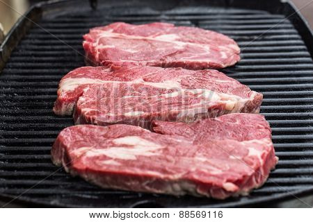 Fresh beef steaks on grill or BBQ