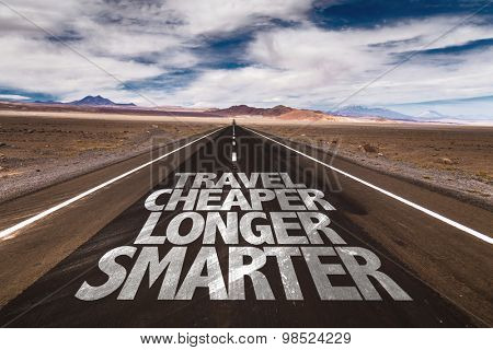Travel Cheaper Longer Smarter written on desert road