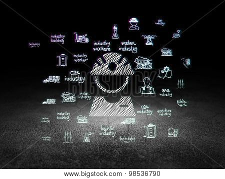 Manufacuring concept: Factory Worker in grunge dark room