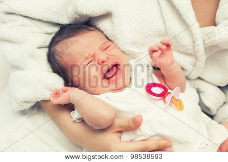 Close up image of crying newborn baby