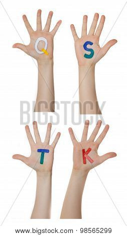 Alphabet (letters) painted on children hands.  Rises up hands.