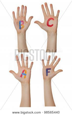 Alphabet (letters) painted on children hands.  Rises up hands.