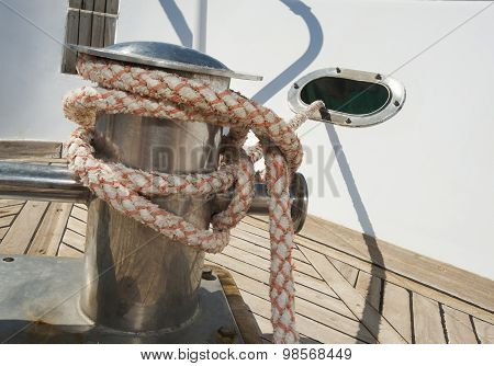 Closeup Of A Boat Capstan And Rope
