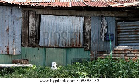 Side of Old Building In Slum