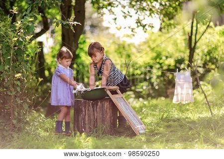 Little Helper Girls Sisters Washes Clothes Using The Washboard Outdoors