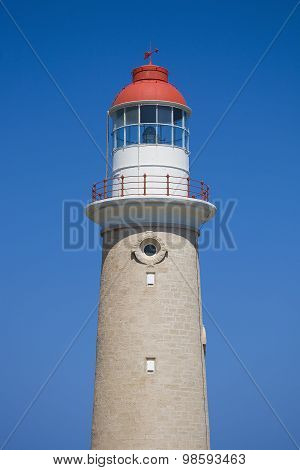 Lighthouse against clear blue sky